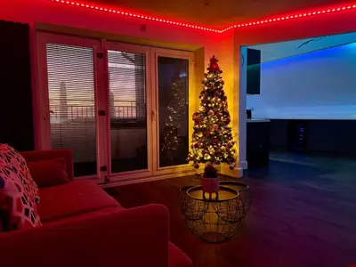 a christmas tree in a living room with a couch at Franks Apt 4 - Roof Terrace - Sleeps 6 in Blackpool