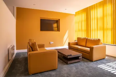 a living room with two chairs and a table at The Castle Collection - 5 Union Court in Liverpool