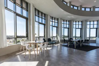 a large room with tables and chairs and windows at For Students Aparto Caton Court Lancaster in Lancaster