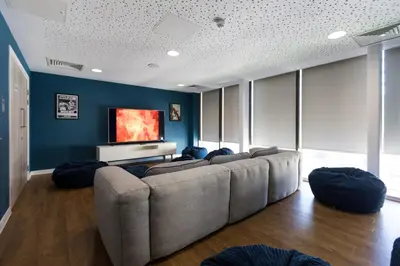 a living room with a couch and a flat screen tv at For Students Aparto Caton Court Lancaster in Lancaster