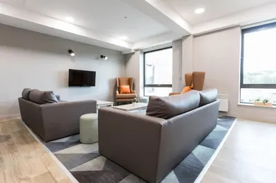 a living room with two couches and a tv at For Students Aparto Caton Court Lancaster in Lancaster