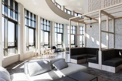 a living room filled with furniture and windows at For Students Aparto Caton Court Lancaster in Lancaster