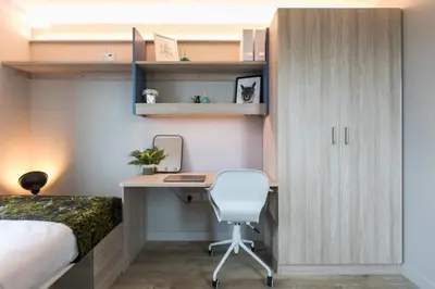 a bedroom with a bed and a desk with a chair at For Students Aparto Caton Court Lancaster in Lancaster