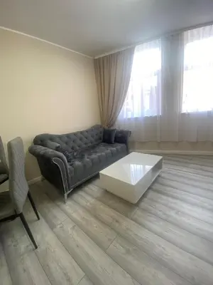 a living room with a couch and a coffee table at Jackson Holiday Apartments in Blackpool