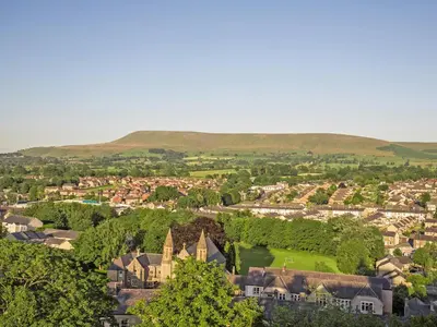 an aerial view of a town with hills in the background at Bramble Cottage - 27978 in Whalley