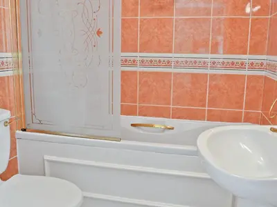 a bathroom with a toilet and a sink at Hope Cottage in Lindale