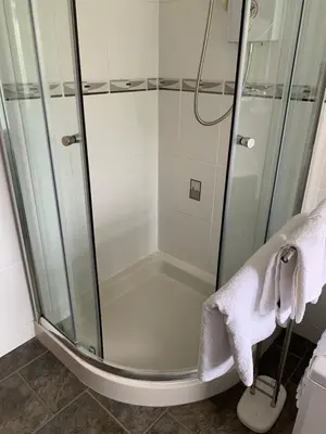 a shower with a glass enclosure in a bathroom at Kents Bank Holiday - Pet Friendly with Bay Views in Grange Over Sands