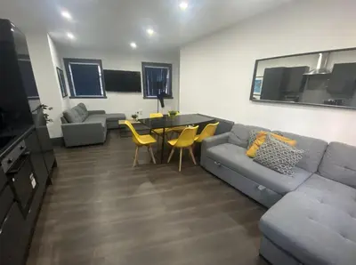 a living room with a couch and a table at Temple Court by UStay Aparthotels in Liverpool