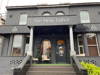 a building with the new tabbot sign on it at The New Talbot Hotel in Southport