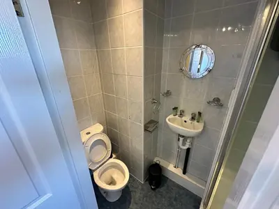 a bathroom with a toilet and a sink at B&B Runway Blackpool - Minutes From Winter Gardens - Dog Friendly - Exceptionally Quiet - Very Close H&A Social Club in Blackpool