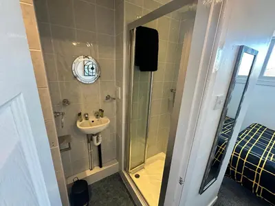 a bathroom with a shower and a sink at B&B Runway Blackpool - Minutes From Winter Gardens - Dog Friendly - Exceptionally Quiet - Very Close H&A Social Club in Blackpool