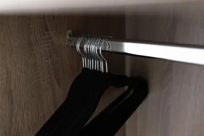 a black shirt hanging on a towel rack at Flatzy - 16 Guests 4 En-suite Central Apartment A in Liverpool