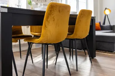 a dining room table with yellow chairs at Flatzy - 16 Guests 4 En-suite Central Apartment A in Liverpool