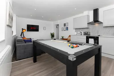 a kitchen and living room with a pool table at Flatzy - 16 Guests 4 En-suite Central Apartment A in Liverpool