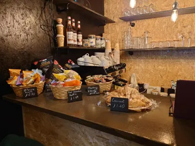 a counter in a restaurant with baskets of food on it at Harriette's Guest House in Blackpool
