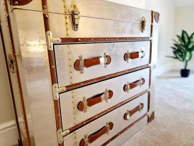 a stack of chest of drawers in a room at The Cruck in Preston