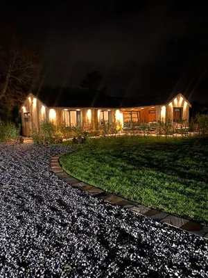a house lit up at night with a walkway at Wayside Lodge in Blackpool