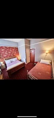 a hotel room with two beds in a room at The Montclair in Blackpool