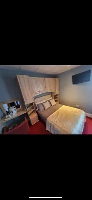 a bedroom with a large bed in a room at The Montclair in Blackpool
