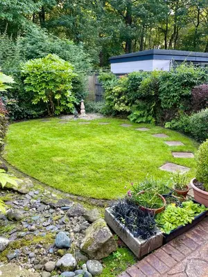 a garden with some plants in a yard at Cheerful 2 Bedroom Home with Off-road parking in Deysbrook