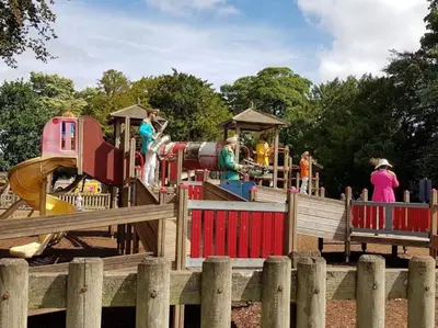a park with a playground with a train at Cheerful 2 Bedroom Home with Off-road parking in Deysbrook