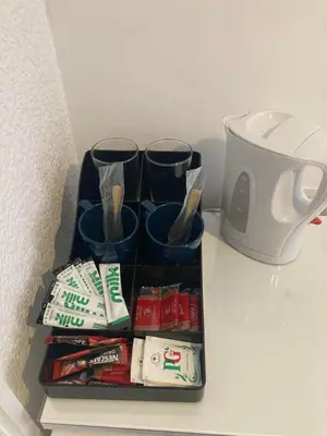 a tray with cups and utensils on a counter at The New Astoria Hotel in Blackpool