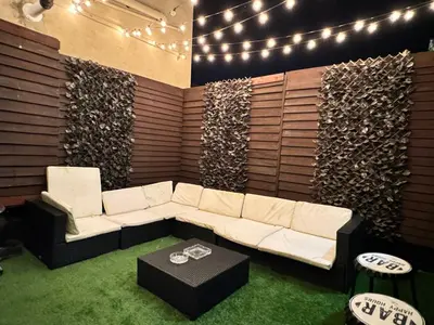 a living room with a white couch and a table at 4 bed 4 bath House with Free Parking, 5 Mins to LFC and 15 Mins to City Centre in Liverpool
