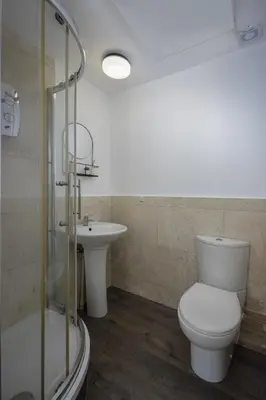 a bathroom with a toilet and a sink at Seaside Suite 1 - Great Location Perfect For Long Stays in Blackpool
