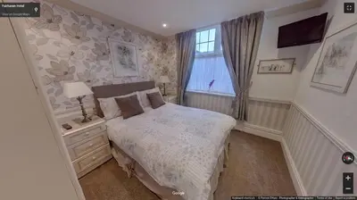 a small bedroom with a bed and a window at Fairhaven Palentine Road in Blackpool