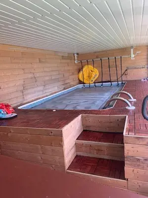 a hot tub in a brick wall with a mattress at Family Holiday Home in Blackpool