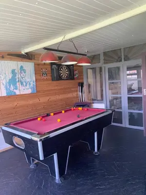 a pool table in a room with a pool table at Family Holiday Home in Blackpool