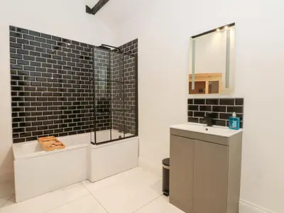 a bathroom with a sink and a mirror at 7 Holly Barn in Preston