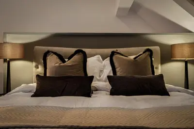 a white bed with two pillows on top of it at Spengarth House by STAMP SA in Blackpool
