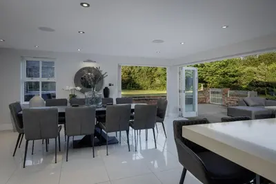 a dining room with a table and chairs at Spengarth House by STAMP SA in Blackpool