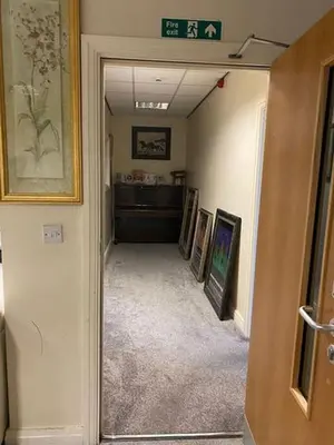a hallway with paintings on the walls of a building at ART APARTMENT in Fleetwood