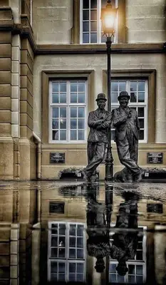 a statue of two men standing next to a street light at Newly renovated 4 bedroom house in Ulverston in Ulverston