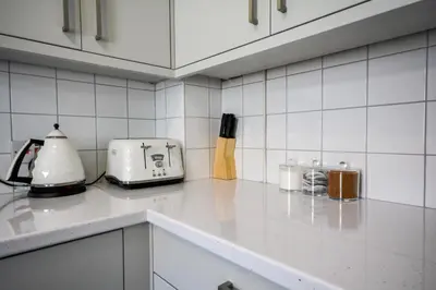 a kitchen counter with a toaster and a toaster at Stay with Alexandra - Free Parking - Free Wifi Superb Location in Liverpool