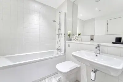 a white bathroom with a toilet and a sink at 35 percent Off Stylish Liverpool Abode in Liverpool