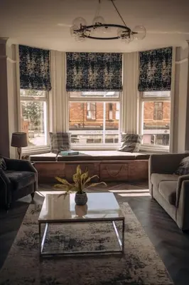 a living room with a couch and a table at The Dunes, Lytham St Annes in Lytham St Annes