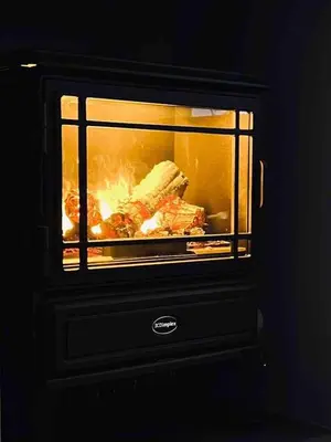 a fireplace with some food cooking in it at The Windmill, Lytham St Annes in Saint Annes on the Sea