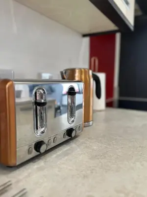 a toaster oven sitting on top of a counter at The Pier Suite Serviced Apartment Blackpool in Blackpool