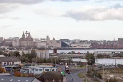 a view of a city with a river and buildings at Weekly & Monthly stays in Penthouse for Contractors or Leisure Single or Superking beds available in Birkenhead
