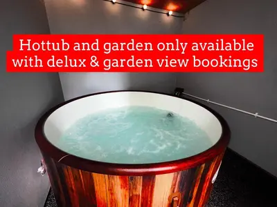 a hot tub and garden only available with deluxe and garden view books at New osborne hot tub and jacuzzi suites in Blackpool