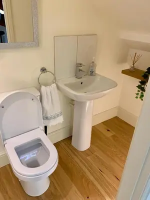 a bathroom with a white toilet and a sink at Stunning 3 Bedroom Penthouse in Ulverston Center in Ulverston