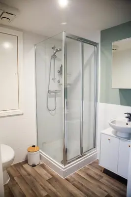 a bathroom with a shower and a sink at City Centre short & long stay apartment in Liverpool