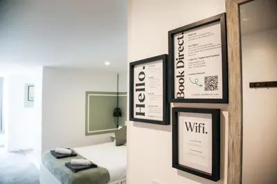 two pictures of a bedroom with a bed and a mirror at City Centre short & long stay apartment in Liverpool
