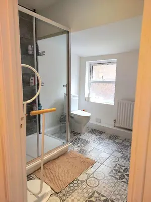 a bathroom with a toilet and a glass shower at Liverpool Newington Stay in Liverpool