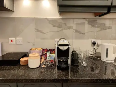 a kitchen counter with a coffee maker on it at Liverpool Newington Stay in Liverpool