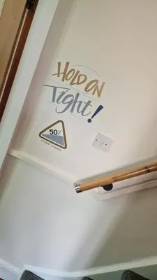 a sign on the ceiling of a room at Carr Garth in Arnside