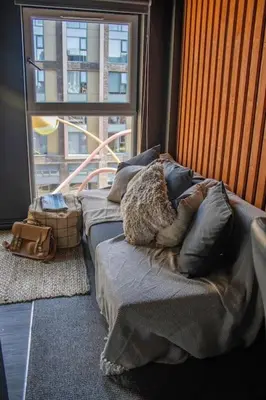 a bed in a room with a large window at One of Kind Boutique Pad in Liverpool